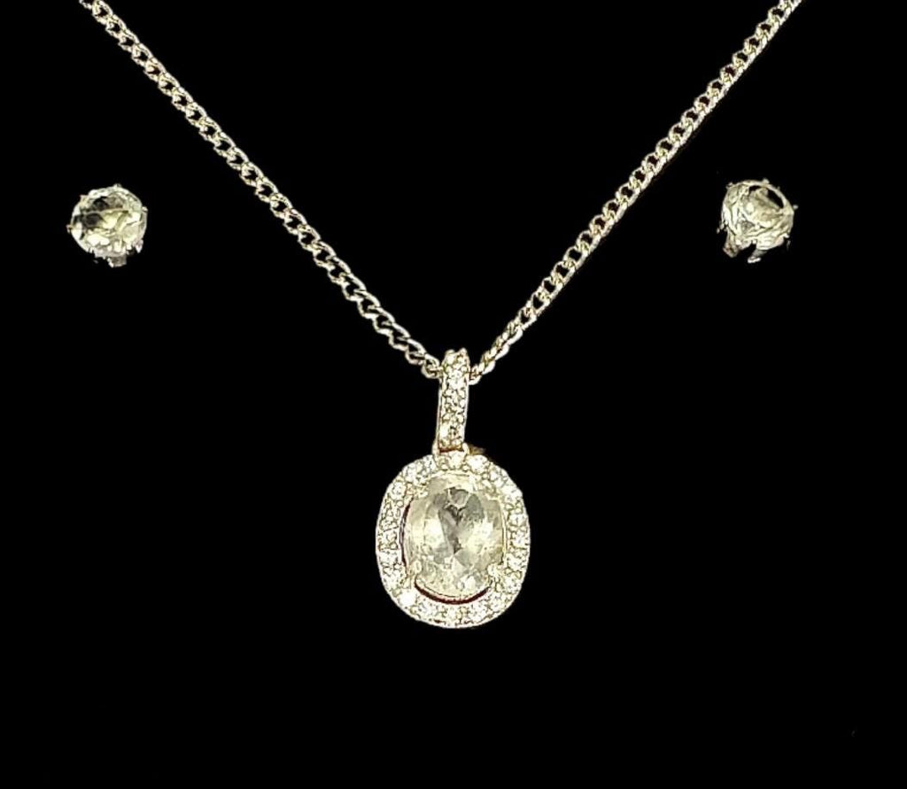 Another elegant Sancturna piece – 5mm clear quartz earrings with an 8x6mm pendant, set on solid .925 sterling silver.