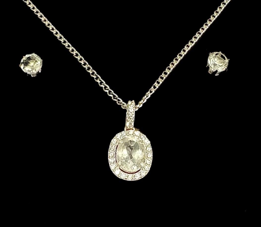 Another elegant Sancturna piece – 5mm clear quartz earrings with an 8x6mm pendant, set on solid .925 sterling silver.