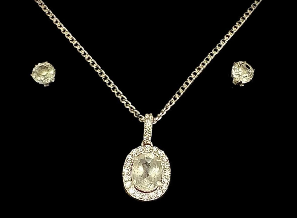 Another elegant Sancturna piece – 5mm clear quartz earrings with an 8x6mm pendant, set on solid .925 sterling silver.