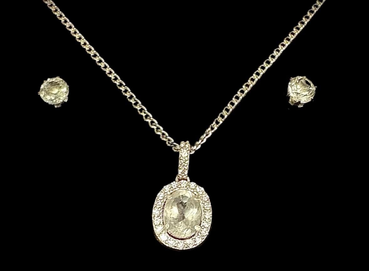 Another elegant Sancturna piece – 5mm clear quartz earrings with an 8x6mm pendant, set on solid .925 sterling silver.