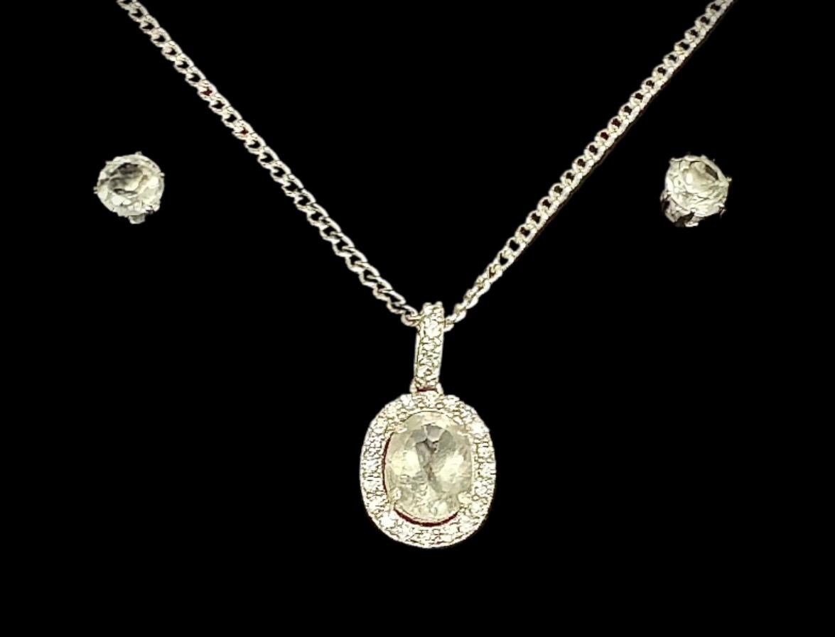 Another elegant Sancturna piece – 5mm clear quartz earrings with an 8x6mm pendant, set on solid .925 sterling silver.